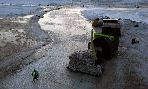 Last Ride- A cyclist takes on last commute ride of the Red River Mutual ice trail at the Forks on the Assiniboine River at the mouth of the Red River  -Officials closed the trail yesterday with concerns of thin ice and are advising people to stay off the river-Standup Photo- Mar 10, 2015   (JOE BRYKSA / WINNIPEG FREE PRESS)