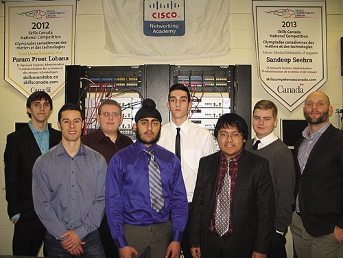 Canstar Community News Feb. 6 2014 - (left to right) Sisler High School's Cyber Defence Challenge squad (left to right) Nick Dixon, Robert Esposito (coach), Arran Retzlaff, Ajit Matharoo, Devyn Hrechkosy, Jarren Mercado, Michael Czelen and Charles Bazilewich (instructor) (JARED STORY/THE TIMES/CANSTAR COMMUNITY NEWS)