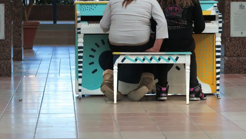 Two young teenage girls play the piano at Portage Place Mall Tuesday afternoon, See story on malls becoming place for pimps to recruit.   March 10, 2015  / Winnipeg Free Press.