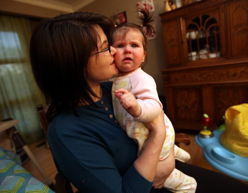 Tara Leger (with her baby Zoe) was harrassed for several minutes by a man who appeared to be a security guard about getting out of the public eye and into a family washroom. She refused. She posted her experience on Facebook and got an apology from the mall manager. See Geoff Kirbyson's story. Maarch 10, 2015 - (Phil Hossack / Winnipeg Free Press)
