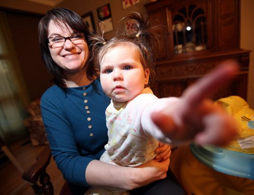 Tara Leger (with her baby Zoe) was harrassed for several minutes by a man who appeared to be a security guard about getting out of the public eye and into a family washroom. She refused. She posted her experience on Facebook and got an apology from the mall manager. See Geoff Kirbyson's story. March 10, 2015 - (Phil Hossack / Winnipeg Free Press)