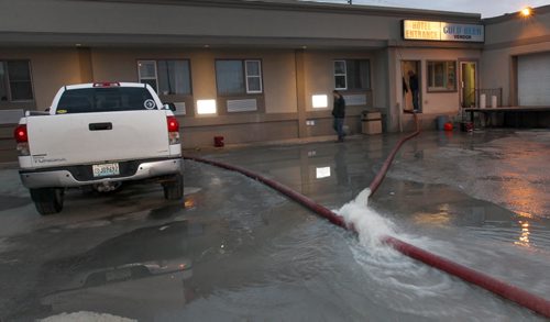 Crews are Scrabbling this morning to drain water from the basement at the Airport Motor Inn. -1800 Ellice Ave Wednesday morning- A water-main burst causing the basement to fill with water  Patrons of the hotel had to leave this morning as water was shut off-Standup Photo- Mar 11, 2015   (JOE BRYKSA / WINNIPEG FREE PRESS)