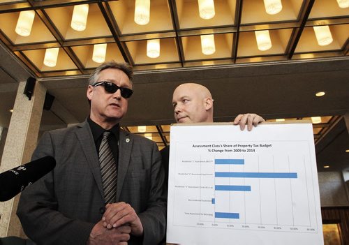 Coun. Ross Eadie (left) with Coun. Jason Schreyer (right) unveils an alternative city budget this afternoon that he says will ease tax burden on homeowners. 150311 March 11, 2015 Mike Deal / Winnipeg Free Press