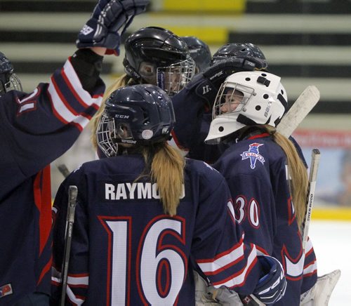 SPORTS - The 3rd annual Female World Sport School Challenge (FWSSC), hosted by St. Marys Academy (SMA), takes place at the MTS Iceplex from March 12-15, 2015. Games begin at 9:30 AM on Thursday, March 12 and conclude with the Gold medal game on Sunday, March 15 at 1:30 PM. Here St. Mary;s Academy in dark blue celebrate the win 2-0 over Banff. #16 Drew Raymond and goalie #30 Tory Micklash. BORIS MINKEVICH/WINNIPEG FREE PRESS MARCH 12, 2015