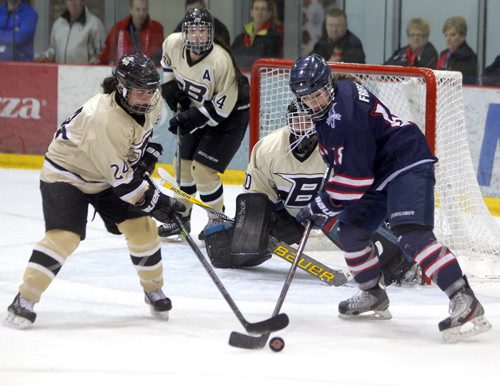 SPORTS - The 3rd annual Female World Sport School Challenge (FWSSC), hosted by St. Marys Academy (SMA), takes place at the MTS Iceplex from March 12-15, 2015. Games begin at 9:30 AM on Thursday, March 12 and conclude with the Gold medal game on Sunday, March 15 at 1:30 PM. Banff #24 Raphaelle Grenier, #14 Andie Romaniuk, goalie #30 Rachel Fontinha, and St Mary's #18 Kayla Friesen. BORIS MINKEVICH/WINNIPEG FREE PRESS MARCH 12, 2015