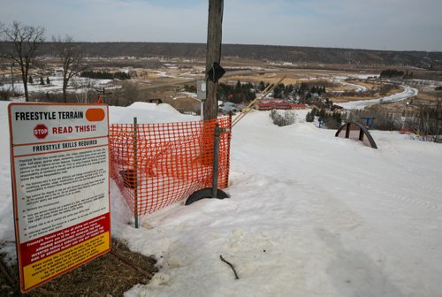 The sign warning of freestyle terrain at the top of the two black diamond runs at Holiday Mountain ski hill. Kelsey Brewster, 13, died Thursday, one week after crashing into the snow fence along the side of his expert hill while on a school ski trip March 5.  150312 - Thursday, March 12, 2015 - (Melissa Tait / Winnipeg Free Press)
