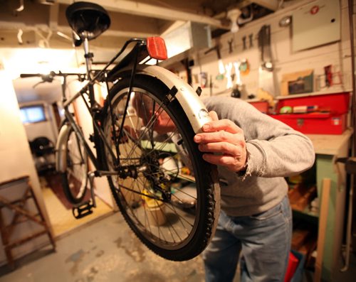 MONEY MAKEOVER - "Howard", forced into early retirement and unsure of his options gets his bike ready for some inexpensive retirement options. See Joel Schlessinger story.  (March 12, 2015 - Phil Hossack / Winnipeg Free Press)