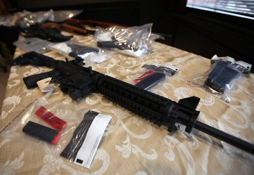 Drugs cash and guns filled display tables at "D" Division headquarters in Winnipeg Friday as officers spoke about Project DARE. See release. March 13, 2015 - (Phil Hossack / Winnipeg Free Press)