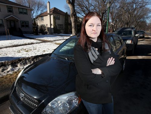 Jen Rennie poses out front of her River Heights home where there have been an ongoing series of autos vandalized. See Alex Paul's story. March 13, 2015 - (Phil Hossack / Winnipeg Free Press)
