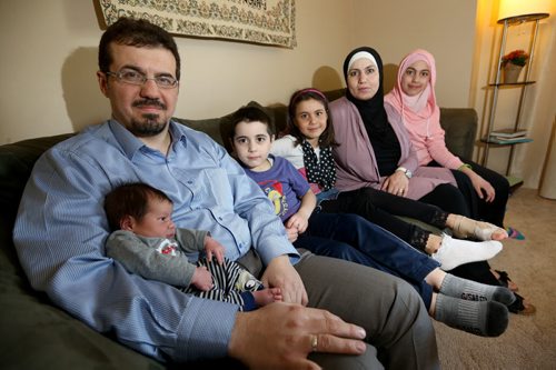Idris Elbakri, President of the Manitoba Islamic Association, with his wife, Bayan, and their children, Dameem, 2 weeks, Abdulghani, 5, Mei, 7 and Sena, 11, Friday, March 13, 2015. (TREVOR HAGAN/WINNIPEG FREE PRESS) - for carol sanders story