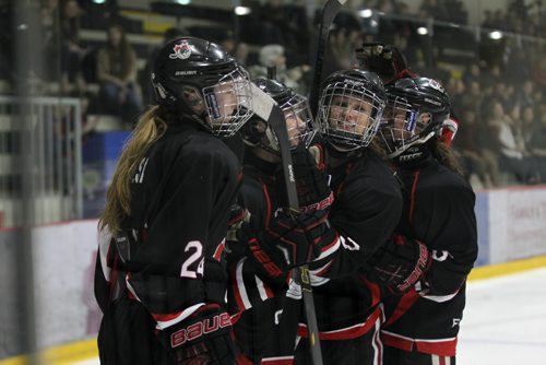 Pursuit of Excellence - Black girls celebrate a goal during the second period of action against  St. Mary's Academy in the FWSSChallenge female hockey tournament at Iceplex Friday night.  POE went on to win the game 3 -2.     March 13, 2015 Ruth Bonneville / Winnipeg Free Press.
