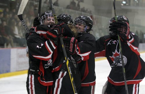 Pursuit of Excellence - Black girls celebrate a goal during the second period of action against  St. Mary's Academy in the FWSSChallenge female hockey tournament at Iceplex Friday night.  POE went on to win the game 3 -2.     March 13, 2015 Ruth Bonneville / Winnipeg Free Press.