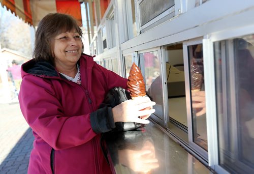 Donna Francis becomes the first customer of the season at the BDI, Saturday, March 14, 2015. She fondly recalled making her first visit to the BDI 55 years ago. (TREVOR HAGAN/WINNIPEG FREE PRESS)