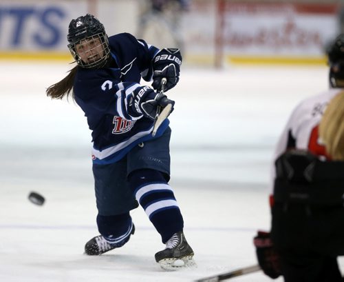 Taylor Wabick of the Shaftesbury Titans fires a shot against the Persuit of Excellence during their game at the Iceplex, Saturday, March 14, 2015. (TREVOR HAGAN/WINNIPEG FREE PRESS)
