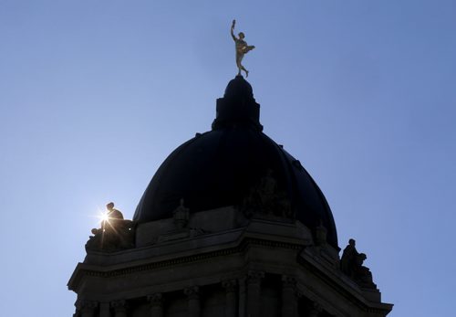 The sun behind the Manitoba Legislative Building, Saturday, March 14, 2015. (TREVOR HAGAN/WINNIPEG FREE PRESS)