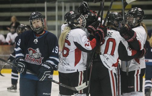 Winnipeg's Shaftesbury Hockey Academy forward Karli Nummikoski (19) reacts while the Pursuit of Excellence team (white) from Kelowna, BC, celebrate their third goal in the final game of the Female World Sport School Challenge at MTS Centre Sunday. 150315 - Sunday, March 15, 2015 -  (MIKE DEAL / WINNIPEG FREE PRESS)