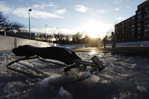 March 15, 2015 - 150315  -  Kids play while the ice melts on an outdoor rink at Mayfair Recreation Centre Sunday, March 15, 2015. John Woods / Winnipeg Free Press