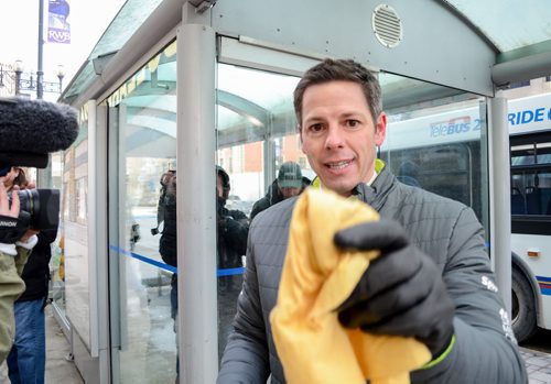 Mayor Brian Bowman helping the press clean off their lens at downtown press conference celebrating Winnipeg's improved downtown cleanliness stats and enhanced services for 2015. Monday, March 16, 2015  - (JENNA DULEWICH/WINNIPEG FREE PRESS)