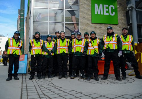 The Metro Enviro-Team at downtown press conference celebrating Winnipeg's improved downtown cleanliness stats and enhanced services for 2015. Monday, March 16, 2015  - (JENNA DULEWICH/WINNIPEG FREE PRESS)