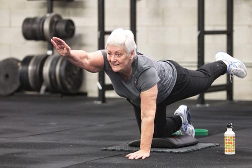 Mavis Puchlik participates in the Legends program at Crossfit 204 (483 Berry Street) work out Monday. The class is geared toward seniors/older athletes and is taught by Crystal Kirby-Peloquin, who is the manager of Crossfit 204.  150316 March 16, 2015 Mike Deal / Winnipeg Free Press