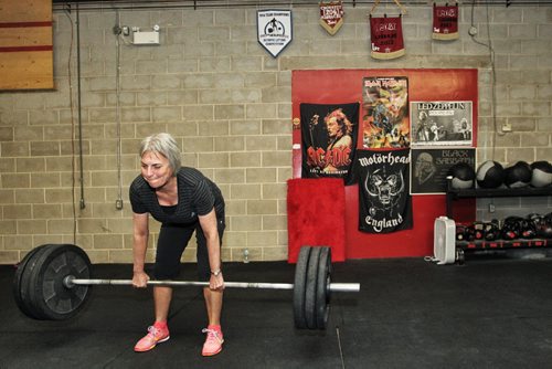 Analyn Baker participates in the Legends program at Crossfit 204 (483 Berry Street) work out Monday. The class is geared toward seniors/older athletes and is taught by Crystal Kirby-Peloquin, who is the manager of Crossfit 204.  150316 March 16, 2015 Mike Deal / Winnipeg Free Press