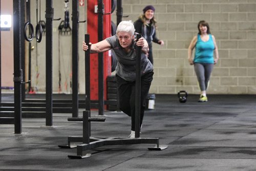 Mavis Puchlik participates in the Legends program at Crossfit 204 (483 Berry Street) work out Monday. The class is geared toward seniors/older athletes and is taught by Crystal Kirby-Peloquin, who is the manager of Crossfit 204.  150316 March 16, 2015 Mike Deal / Winnipeg Free Press