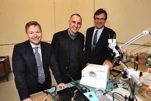 Marshall Ring (left) the CEO of MTA (Manitoba Technology Accelerator), NDP's Economy Minister, Kevin Chief (centre) and the founder of Cubresa, James Schellenburg (right) with a model of one of their highly specialized gamma cameras in the office on Border Street.  150316 March 16, 2015 Mike Deal / Winnipeg Free Press