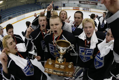 March 16, 2015 - 150316  -  Oak Park Raiders celebrate a win over the St Paul's Crusaders in the AAAA High School Hockey Championship game at St James Civic Centre  Monday, March 16, 2015. John Woods / Winnipeg Free Press