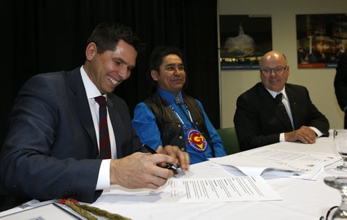 From left , James Wilson, Treaty Commissioner, Chief Nelson Genaille, president, Treaty Land Entitlement Committee of Manitoba (TLE ) and Doug Dobrowolski, president, Association of Manitoba Municipalities (AMM) take part in the  signing of a memorandum of understanding to establish a partnership aimed at enhancing the knowledge of First Nations and Canadians within Manitoba regarding the significance of the Treaties, TLE and the Treaty relationship.  The signing took place during the AMM's Municipal Officials Seminar at the RBC Convention Centre Tuesday.Wayne Glowacki/Winnipeg Free Press March 17 2015