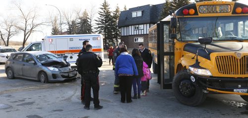 A school bus and car collided at the intersection Dohaney Cres. and Hamilton Ave. Tuesday morning. Adam Wazny story.Wayne Glowacki/Winnipeg Free Press March 17 2015