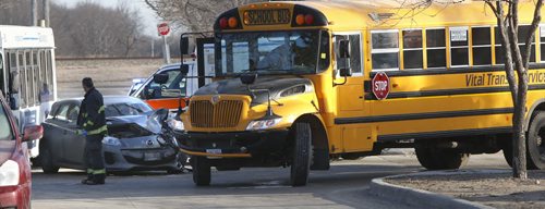 A school bus and car collided at the intersection Dohaney Cres. and Hamilton Ave. Tuesday morning. Adam Wazny story.Wayne Glowacki/Winnipeg Free Press March 17 2015