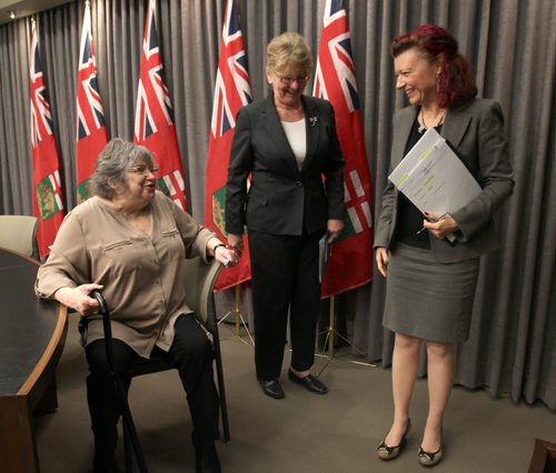 Labour and Immigration Minister Erna Braun, Minister responsible for the Office of the Fire Commissioner, Centre, and Health Minister Sharon Blady, right, with Gail Finkel Manitoba Person with Disabilities following news-conference at Manitoba Legislature Tuesday where it was announced that the Manitoba government will have sprinklers in all seniors homes and hospitals in the province by 2025-  A 7 Million project is already underway to install sprinklers in five personal care homes and one hospital in 2015-16- See Bruce Owen story- Mar 17, 2015   (JOE BRYKSA / WINNIPEG FREE PRESS)