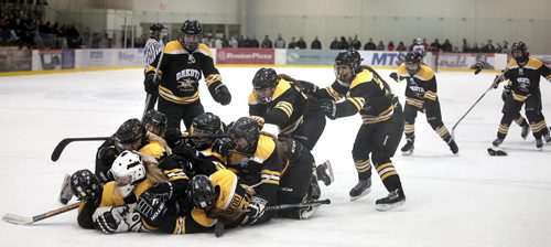 The Dakota Lancers celebrate after winniprg the women's title after a hard fought game finally settled in a shoot out over St Mary's Acadamy. See Paul Wiecek story.  March 17, 2015 - (Phil Hossack / Winnipeg Free Press)