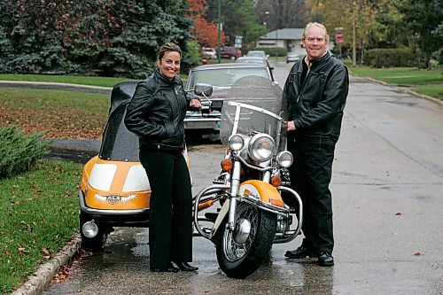 BORIS MINKEVICH / WINNIPEG FREE PRESS  071008 Glen Tedham and his wife Jeannie Tedham pose for a photo next to their motorcycle with sidecar in Winnipeg. They are driving across Canada for ALS awareness and shooting a documentry on it.