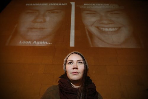 March 17, 2015 - 150317  -  Becca Taylor, a subject in the photography exhibit by KC Adams, is photographed in front of her image projected on the Winnipeg Art Gallery Tuesday, March 17, 2015. John Woods / Winnipeg Free Press