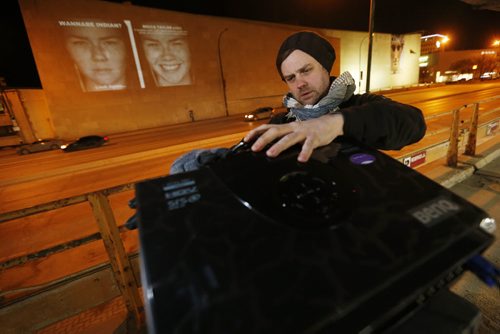 March 17, 2015 - 150317  -  James Patterson of the Shaman Gallery sets up a projector to project the photography exhibit by KC Adams on the Winnipeg Art Gallery Tuesday, March 17, 2015. John Woods / Winnipeg Free Press