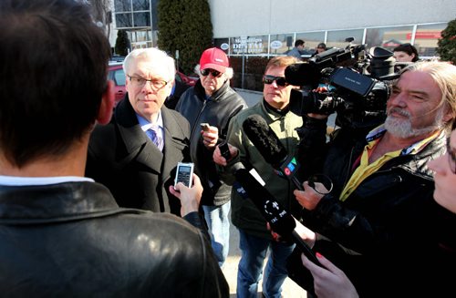 Premier Greg Selinger is met with a barrage of questions from the media during a scrum after abpress conference at the QuickCare Clinic Wednesday. See Bruce Owen story.  March 18, 2015 Ruth Bonneville / Winnipeg Free Press.