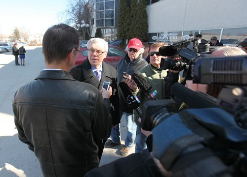 Premier Greg Selinger is met with a barrage of questions from the media during a scrum after abpress conference at the QuickCare Clinic Wednesday. See Bruce Owen story.  March 18, 2015 Ruth Bonneville / Winnipeg Free Press.