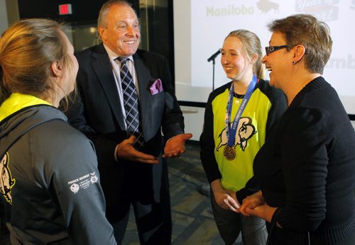 SPORTS - Funding announcement and highlight events for the Year of Sport held at Manitoba Sports Hall of Fame. Left, Children and Youth Opportunities Minister Melanie Wight. Second from right- Tourism, Culture, Heritage, Sport and Consumer Protection Minister Ron Lemieux. Ringette gold medal Canada Games winners left- Raeanne Wysocki and second from right Ryann Bannerman. BORIS MINKEVICH/WINNIPEG FREE PRESS MARCH 18, 2015
