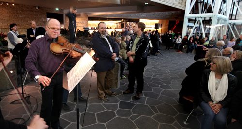 STAND-UP A violist plays at the Canadian Museum of Human Rights Wednesday evening. Conductor Alexander Mickelthwate and members of the symphony orchestrated an "imprompteau flash mop" performance of Beethoven's "Ode to Joy" in the museum's Stuart Clarke Garden of Contemplation. See release.March 18, 2015 - (Phil Hossack / Winnipeg Free Press)
