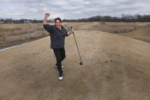 Kimberley Dawn was ecstatic to get back on the golf course at Shooters Family Golf Centre at 2731 Main St in Winnipeg Thursday- The golf Centre opened their driving range last week and today decided to open the course early-Standup Photo- Mar 19, 2015   (JOE BRYKSA / WINNIPEG FREE PRESS)