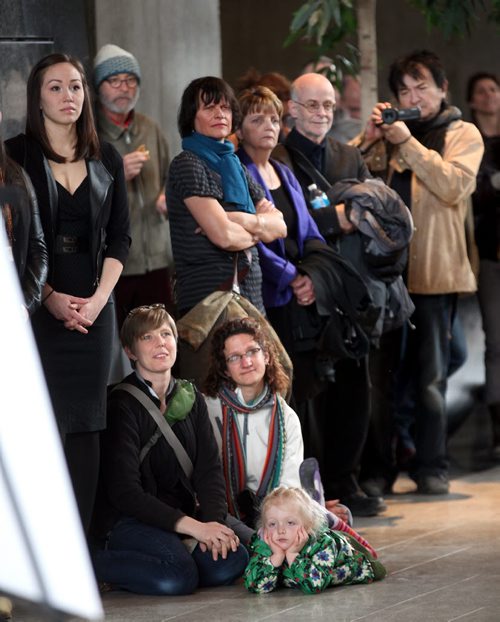 A crowd of around two hundred gathered at the Manitoba Hydro buildings concourse THursday evening to help launch KC Adamss series of portraits called "Perception Series". See Geoff Kirbyson story. March 19, 2015 - (Phil Hossack / Winnipeg Free Press)