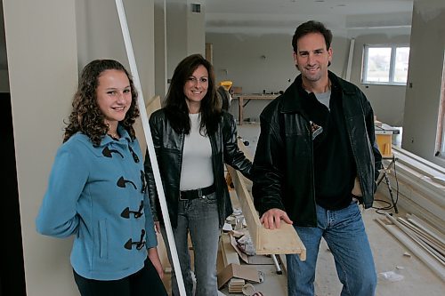 BORIS MINKEVICH / WINNIPEG FREE PRESS  071009 Manitoba Moose coach Scott Arniel with his wife Lia and daughter Stephanie pose for photos at their new house that is under construction in Linden Woods.