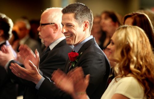 Mayor Brian Bowman accompanied by his wife Tracy applaud the World Gosple Choir's rendition of O'Canada at the  annual "State of the City" banquet and speech. See story. March 20, 2015 - (Phil Hossack / Winnipeg Free Press)