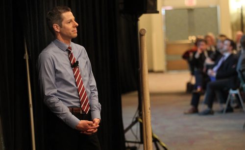 Mayor Brian Bowman waits in the wings as a promotional Winnipeg Film is shown before his annual "State of the City" speech. See story. March 20, 2015 - (Phil Hossack / Winnipeg Free Press)