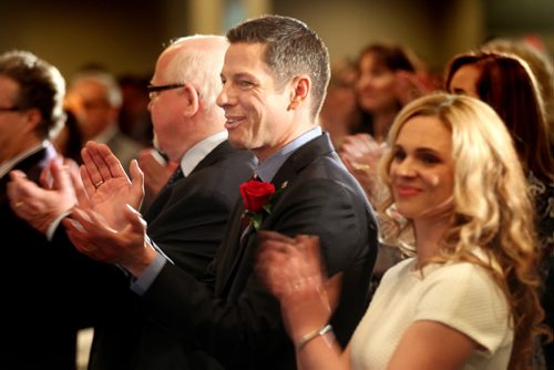Mayor Brian Bowman accompanied by his wife Tracy applaud the World Gosple Choir's rendition of O'Canada at the  annual "State of the City" banquet and speech. See story. March 20, 2015 - (Phil Hossack / Winnipeg Free Press)
