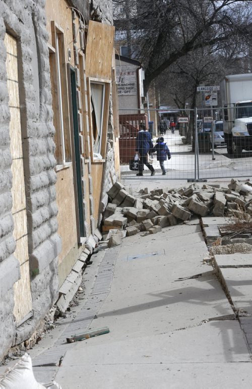 The sunken front sidewalk of the Hood Block at 543 Sargent Avenue at Langside Street owned by Sal Infantino that is set to be demolished.  He also owns the neighbouring X-Cues Billiards and Cafe at 551 Sargent Avenue.  Christian Cassidy "This Was Winnipeg" column  Wayne Glowacki/Winnipeg Free Press March 20 2015