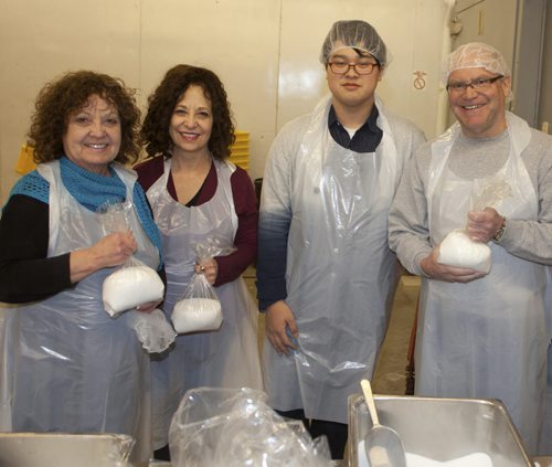 Volunteers from Shaarey Zedek synagogue have been helping out at Winnipeg Harvest for more than 12 years. Pictured, from left, are Shelley Ross, Karen Grant, Max Shin and Ben Berkal. (JOHN JOHNSTON / WINNIPEG FREE PRESS)