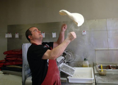 Rob Pearsons  son of owner spins pizza dough at Tony's Master of Pizza, 1100 Pembina Hwy-Tony's has been in business for 50-plus years in the area- See Dave Sanderson 49.8 story - Mar 20, 2015   (JOE BRYKSA / WINNIPEG FREE PRESS)