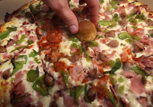 Famous dough ball is placed on centre of pizza from Tony's Master of Pizza, 1100 Pembina Hwy-Tony's has been in business for 50-plus years in the area- See Dave Sanderson 49.8 story - Mar 20, 2015   (JOE BRYKSA / WINNIPEG FREE PRESS)
